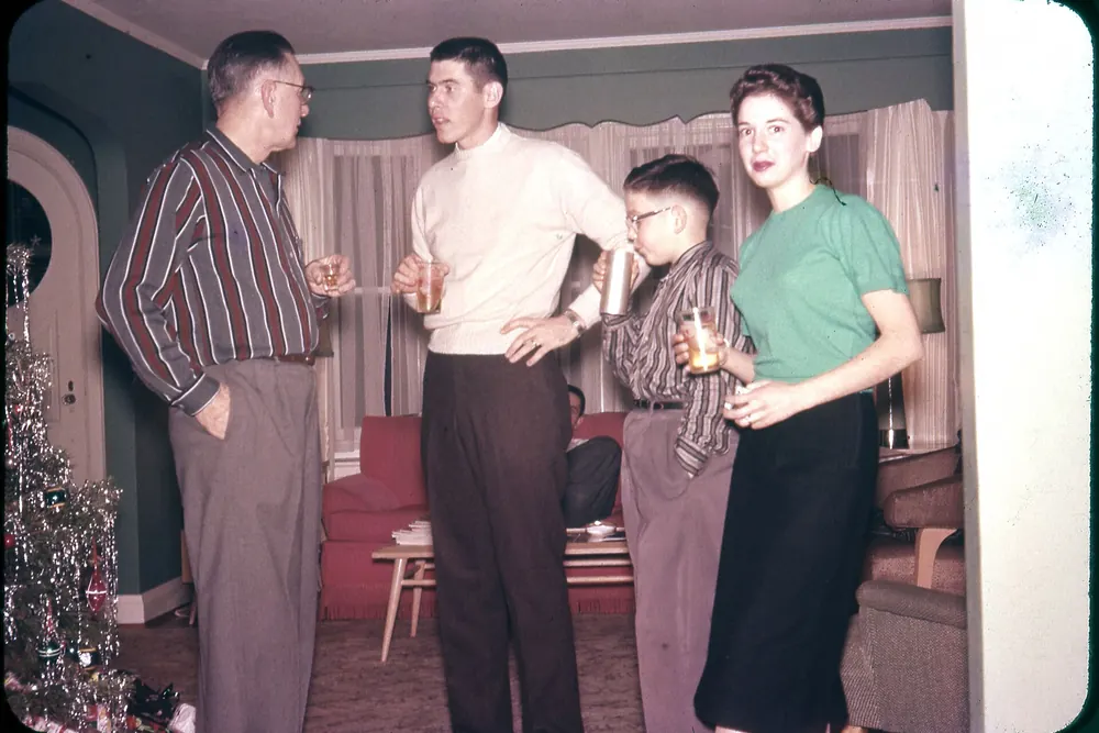 The Mosbacher family talking in a living room at Christmas